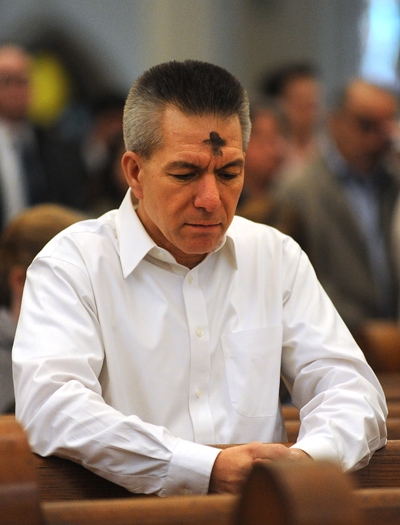 Kevin Shanahan, of Getzville, prays during Ash Wednesday Mass at St. Joseph Cathedral. (Dan Cappellazzo/Staff Photographer)